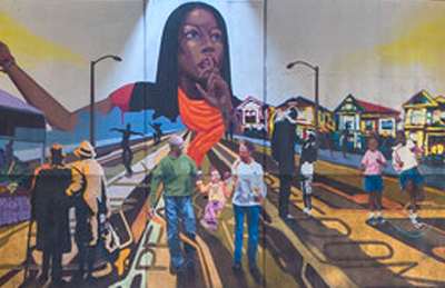 Mural by David Burke and McClymonds High School students, depicting Ja’Khi, the princess of knowledge, overlooking a block party where Oaklanders celebrate unity and change.